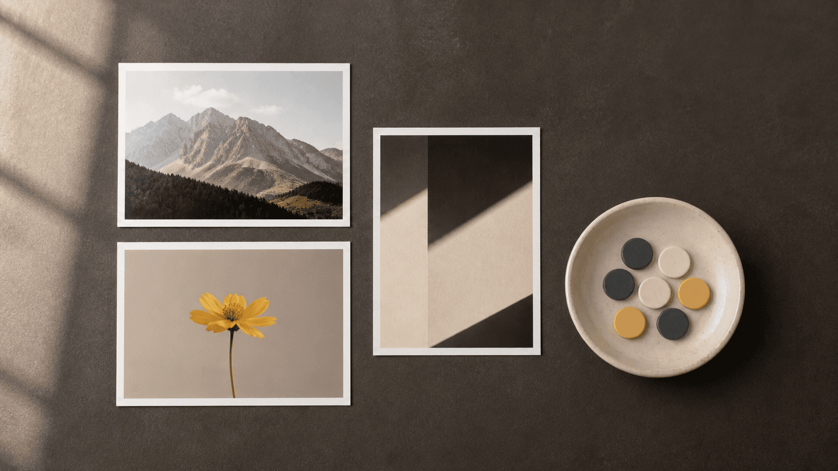 Three photo prints and seven plain tokens arranged on a dark tabletop to represent pay-as-you-go creation