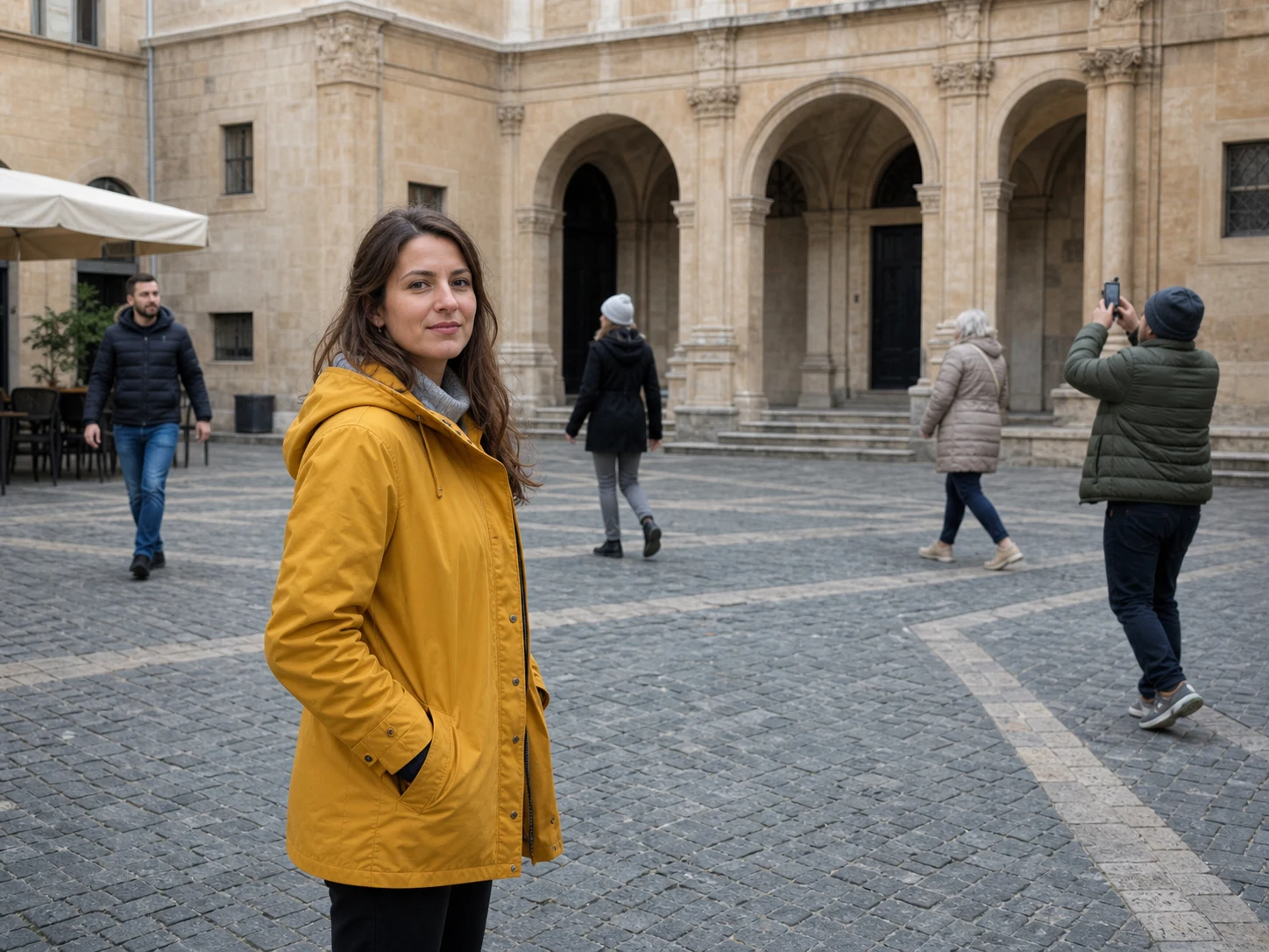A fictional traveler in a stone plaza with four pedestrians in the background